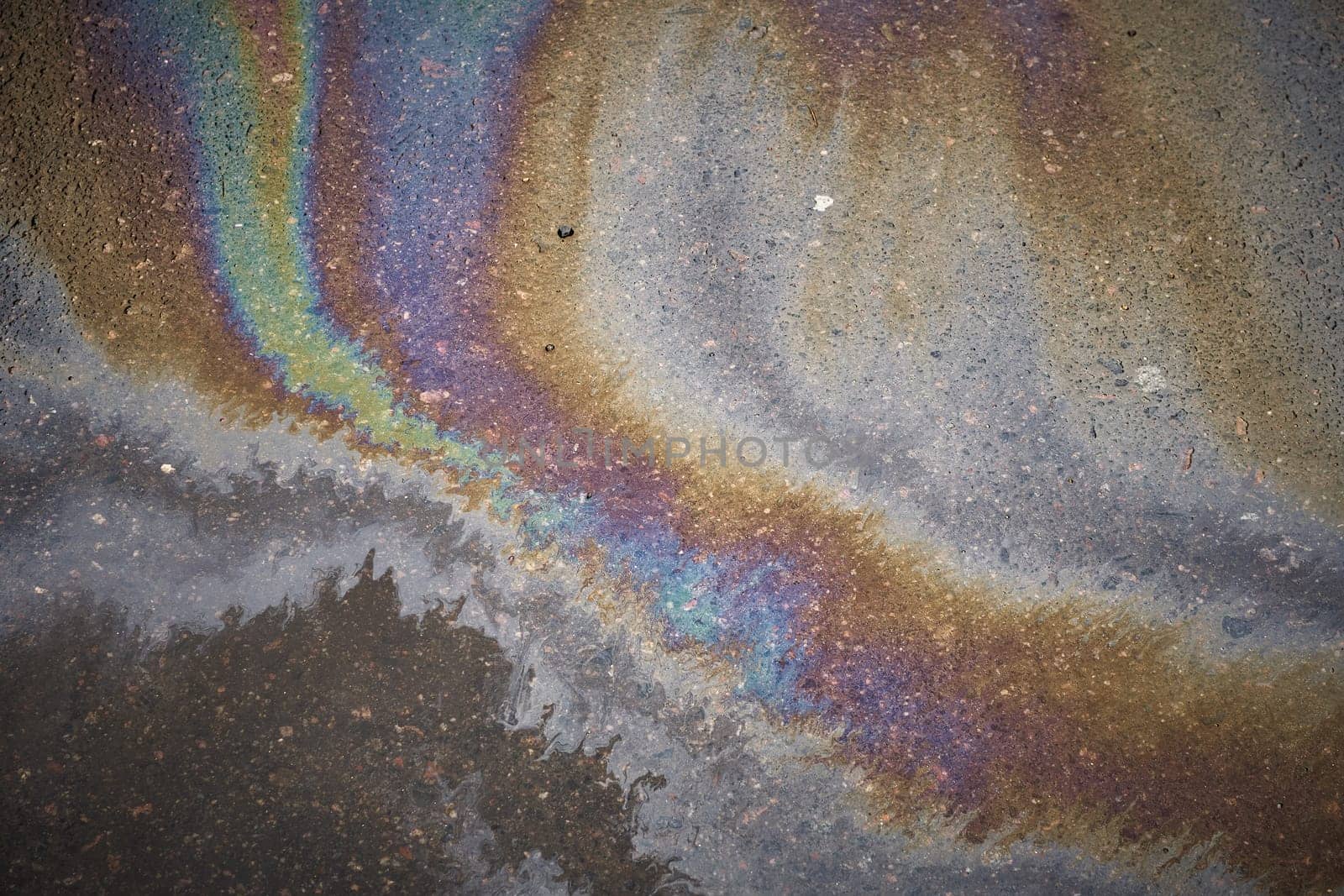 Oil stain, Gas Stain drop from the Car on the Parking Lot Floor. Environmental pollution concept