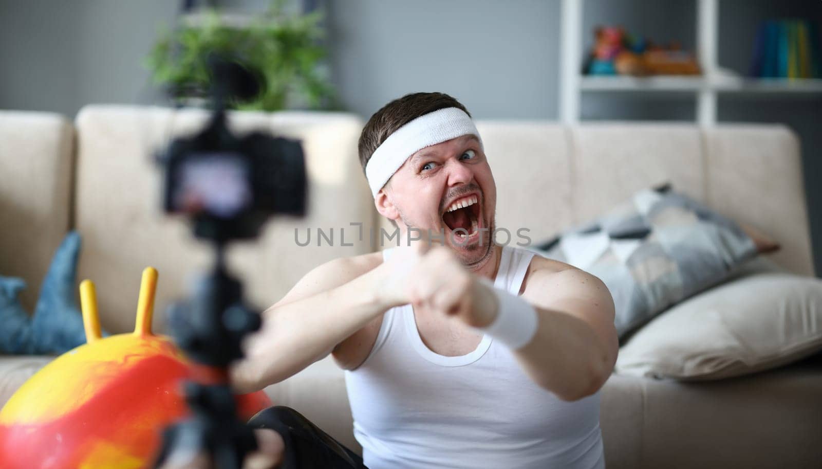 Screaming Vlogger Recording Boxing Video on Camera by kuprevich
