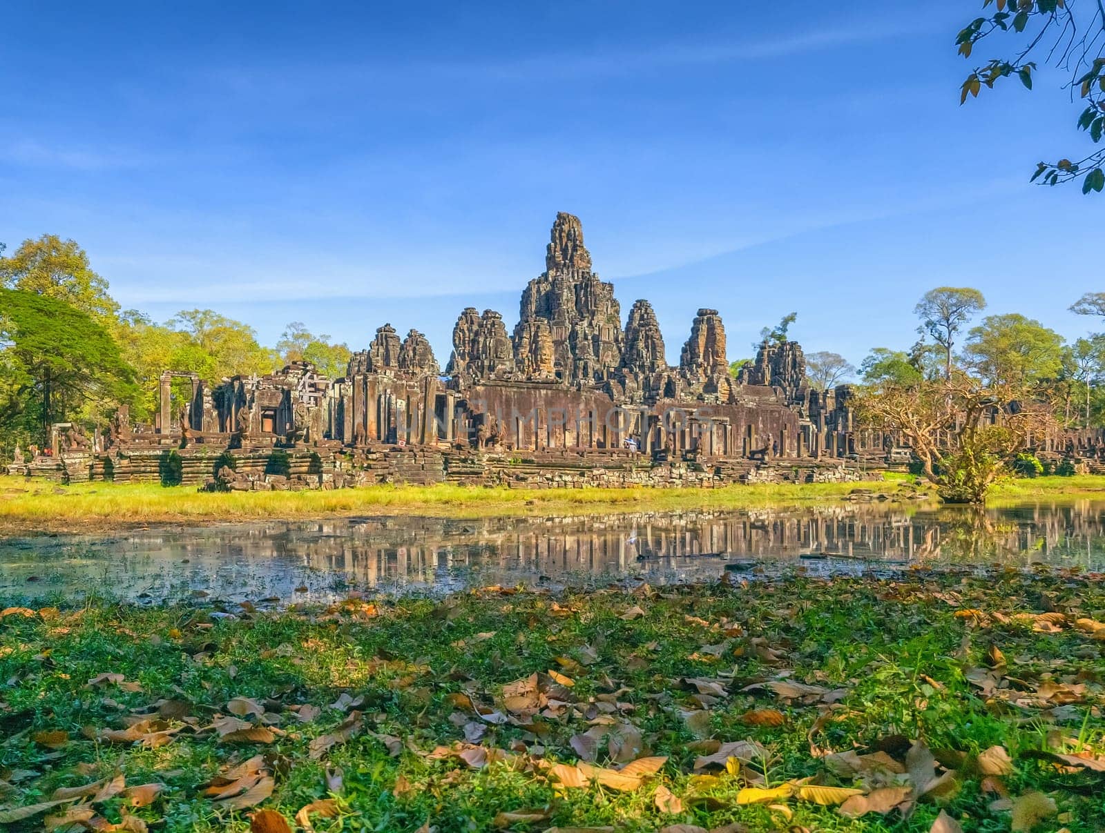 Bayon temple with stone faces of Buddha at Angkor Thom by day, Siem Reap, Cambodia