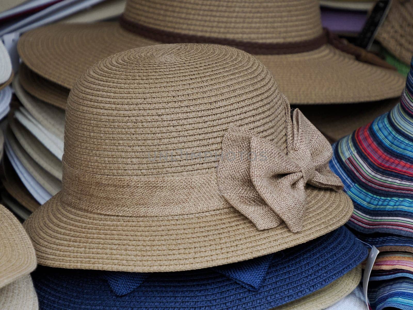 Many Panama hats in a store market by AndreaIzzotti