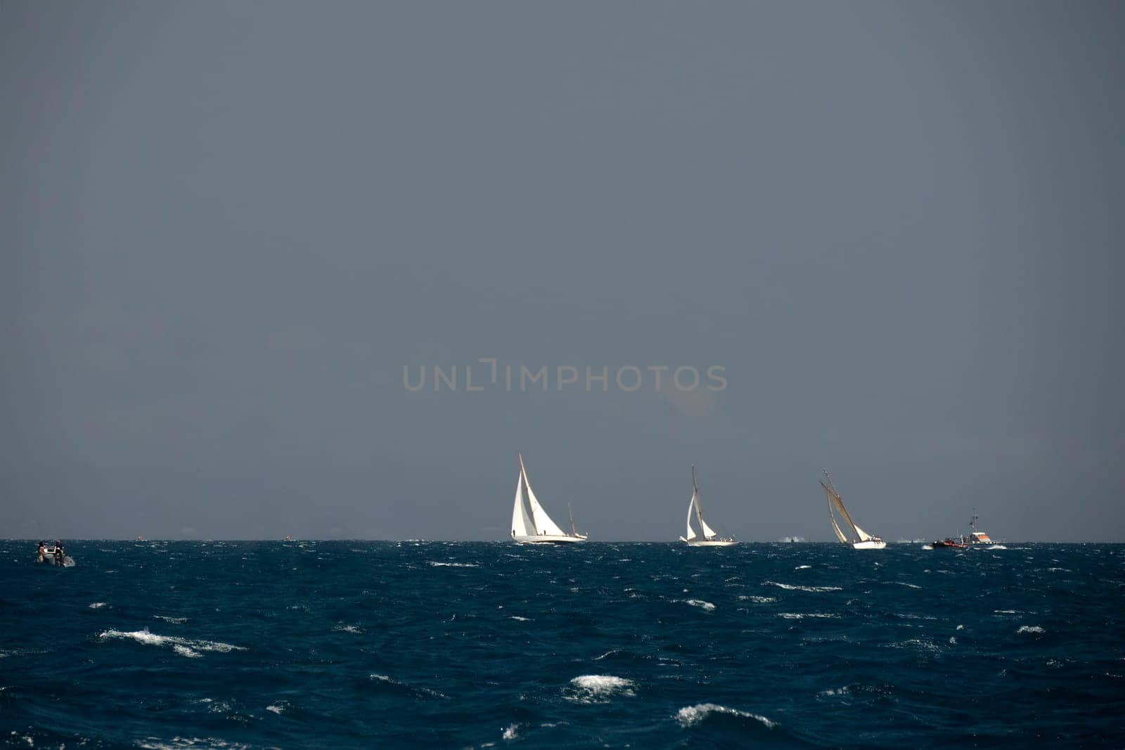 strong wind regatta in barcelona Sailing ship in a strong wind. Yachting by AndreaIzzotti