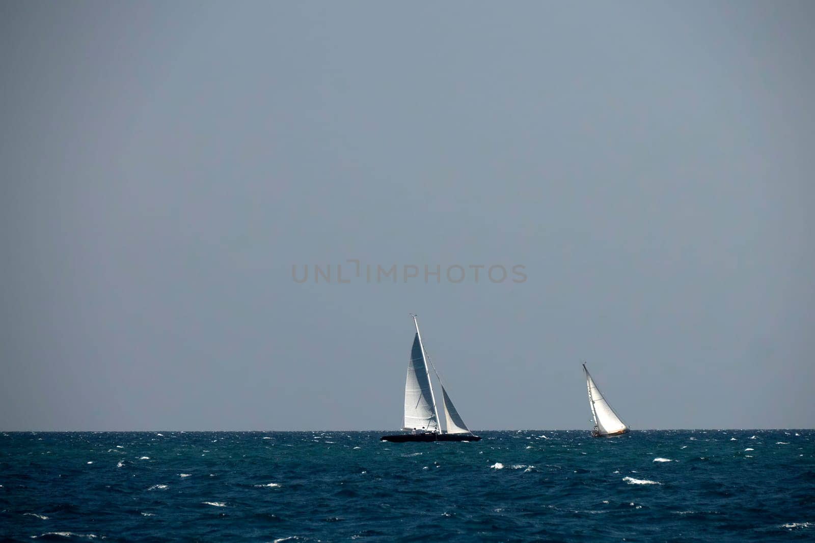 A strong wind regatta in barcelona Sailing ship in a strong wind. Yachting