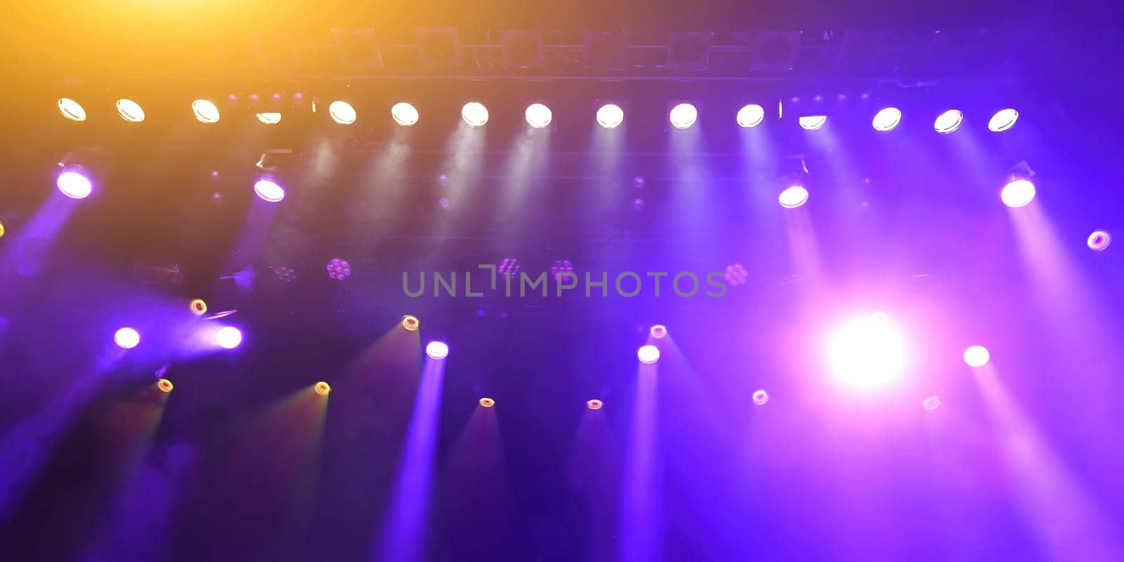 glowing purple atmospheric abstract background of concert spotlights with light and Mist by GekaSkr
