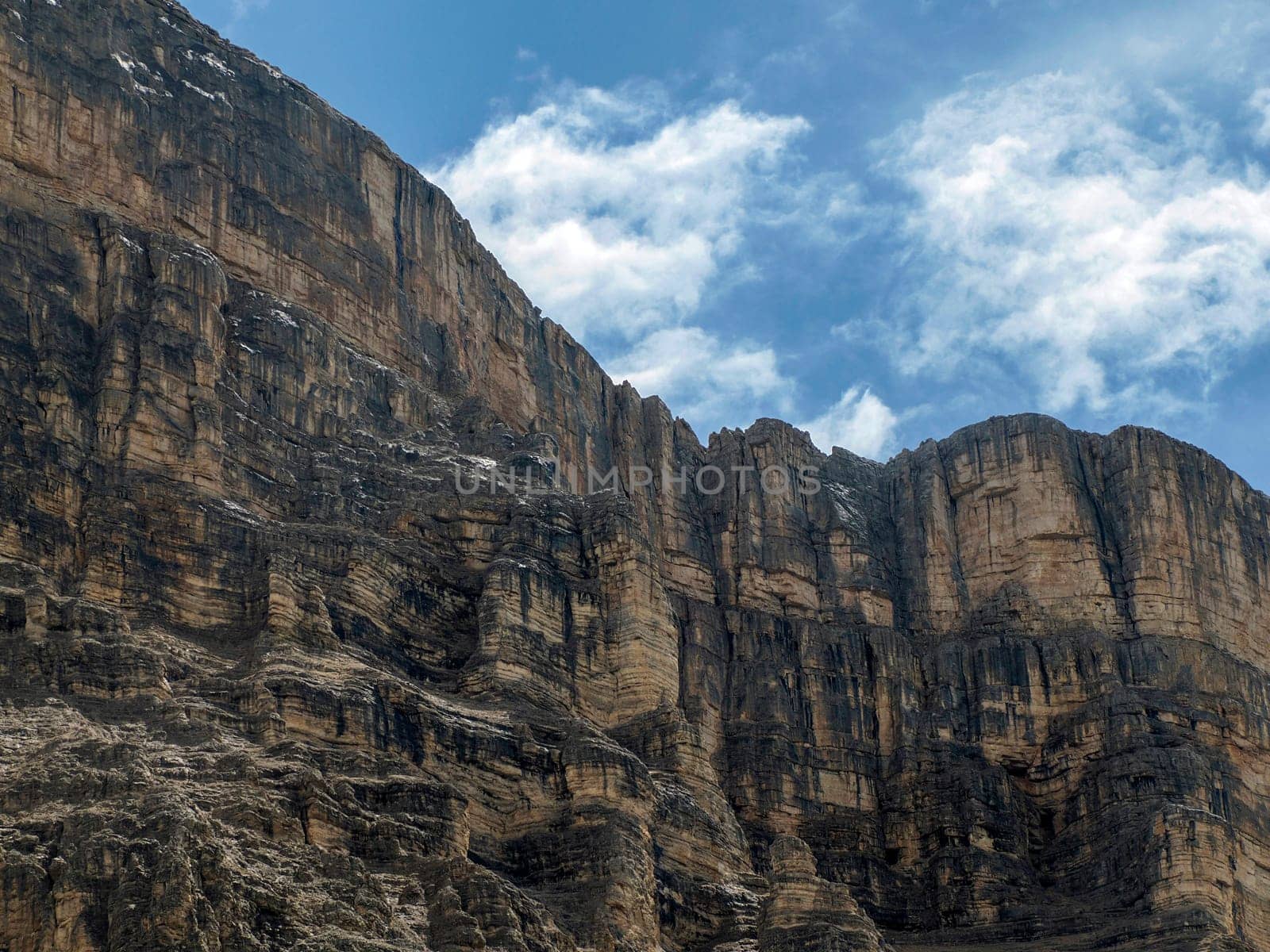 detail of rock of monte croce cross mountain in dolomites badia valley panorama landscape by AndreaIzzotti