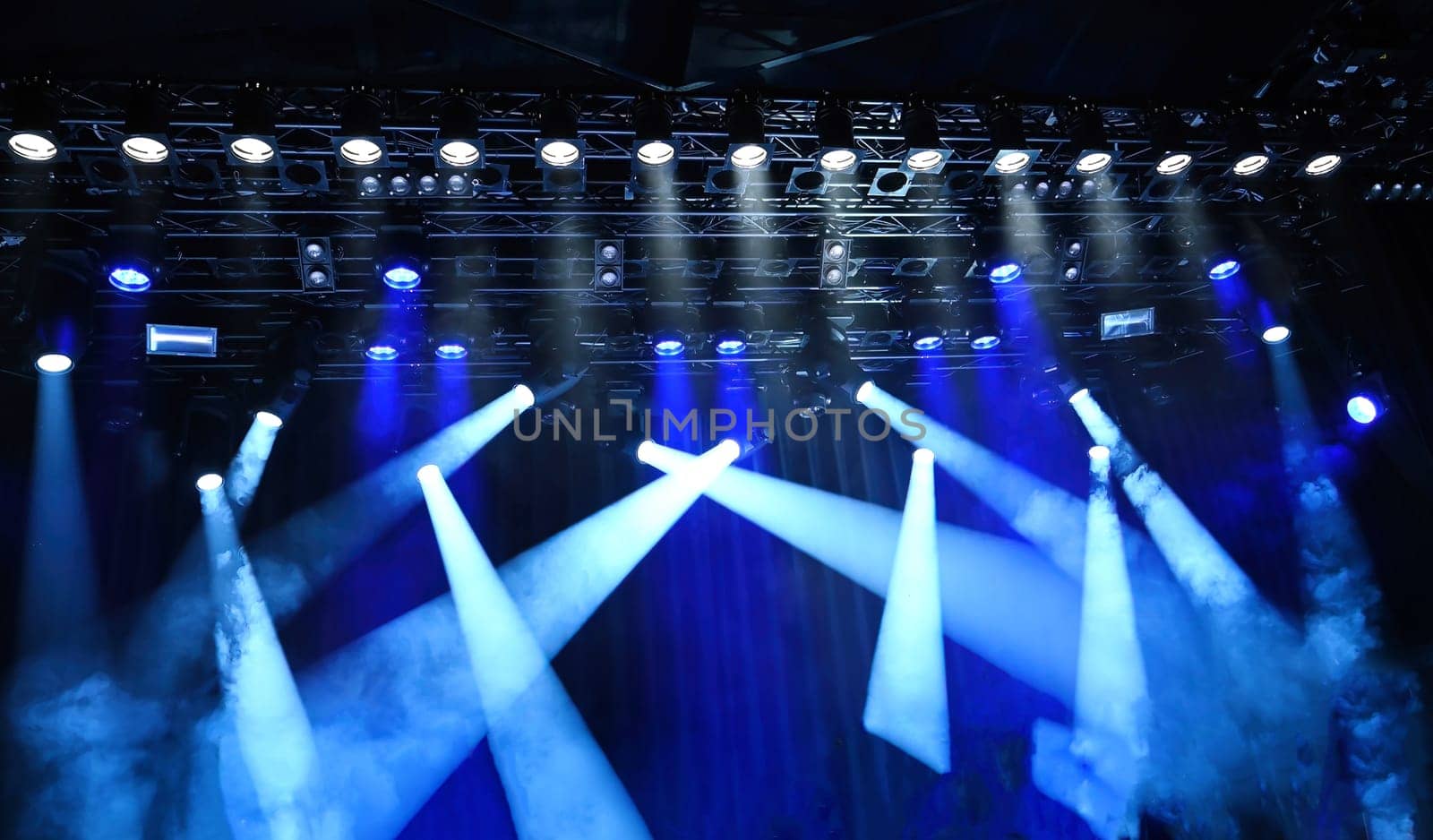 stage ceiling light, bright blue spotlights on a musical stage