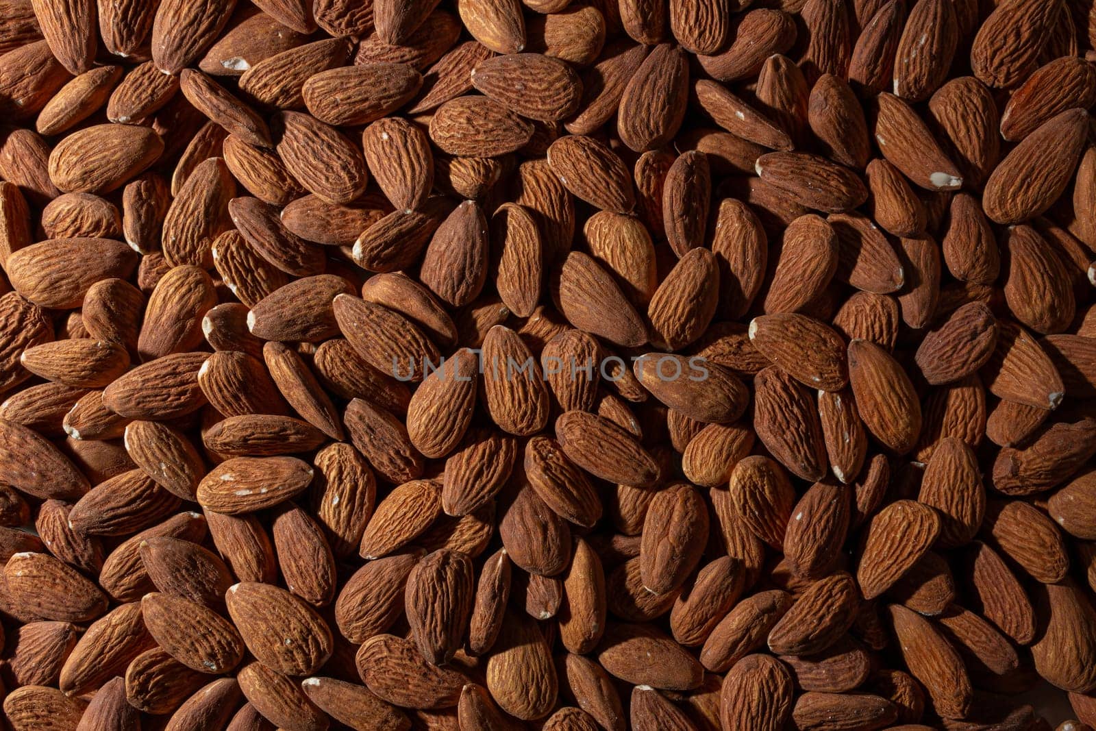 Scattered Almonds. Background from Almond Nuts. Natural High-Calorie Snacks