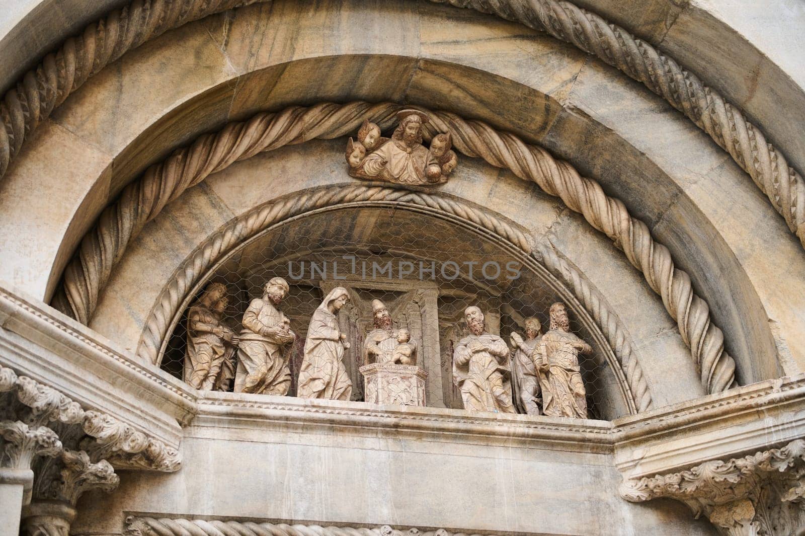 Exterior of the Cathedral in Como city, with Italian architectural details, sculpture, stone carvings. Lombardy. Italy by artgf