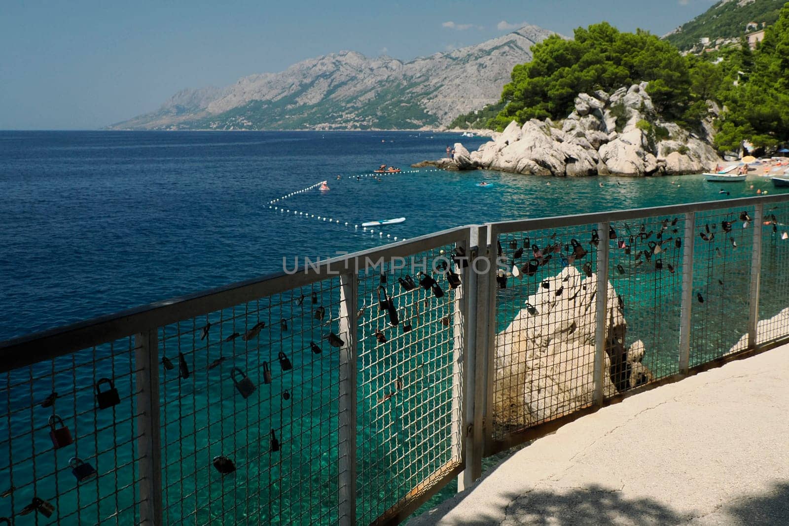 boardwalk over crystal clear water of Adriatic sea in Brela on Makarska Riviera, Dalmatia Croatia