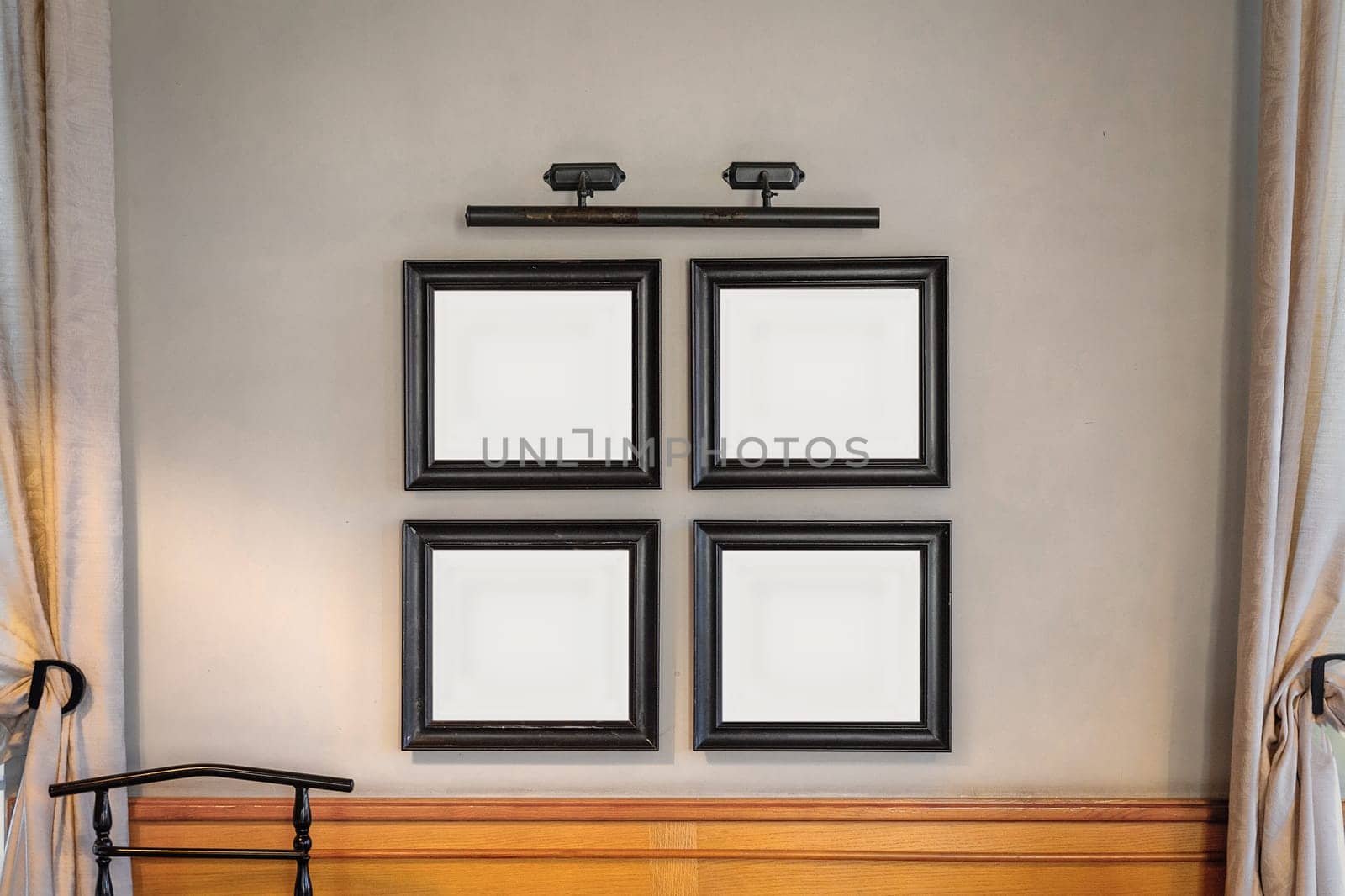 Mockup with 4 frames for a painting or photograph in the wall between the windows in a classic interior.