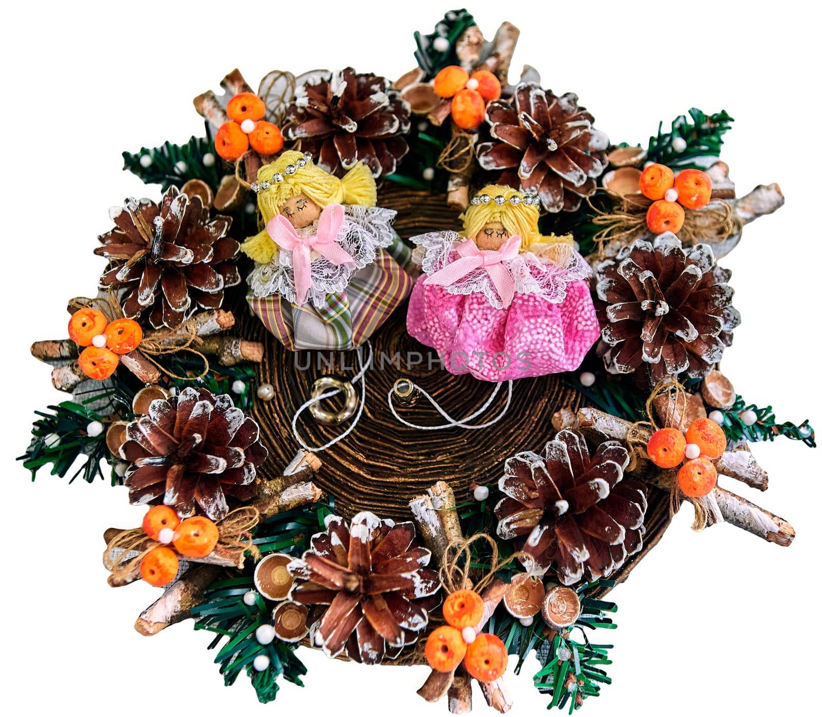 Christmas wreath with pine cones, toys on a white background. With angels in the middle.