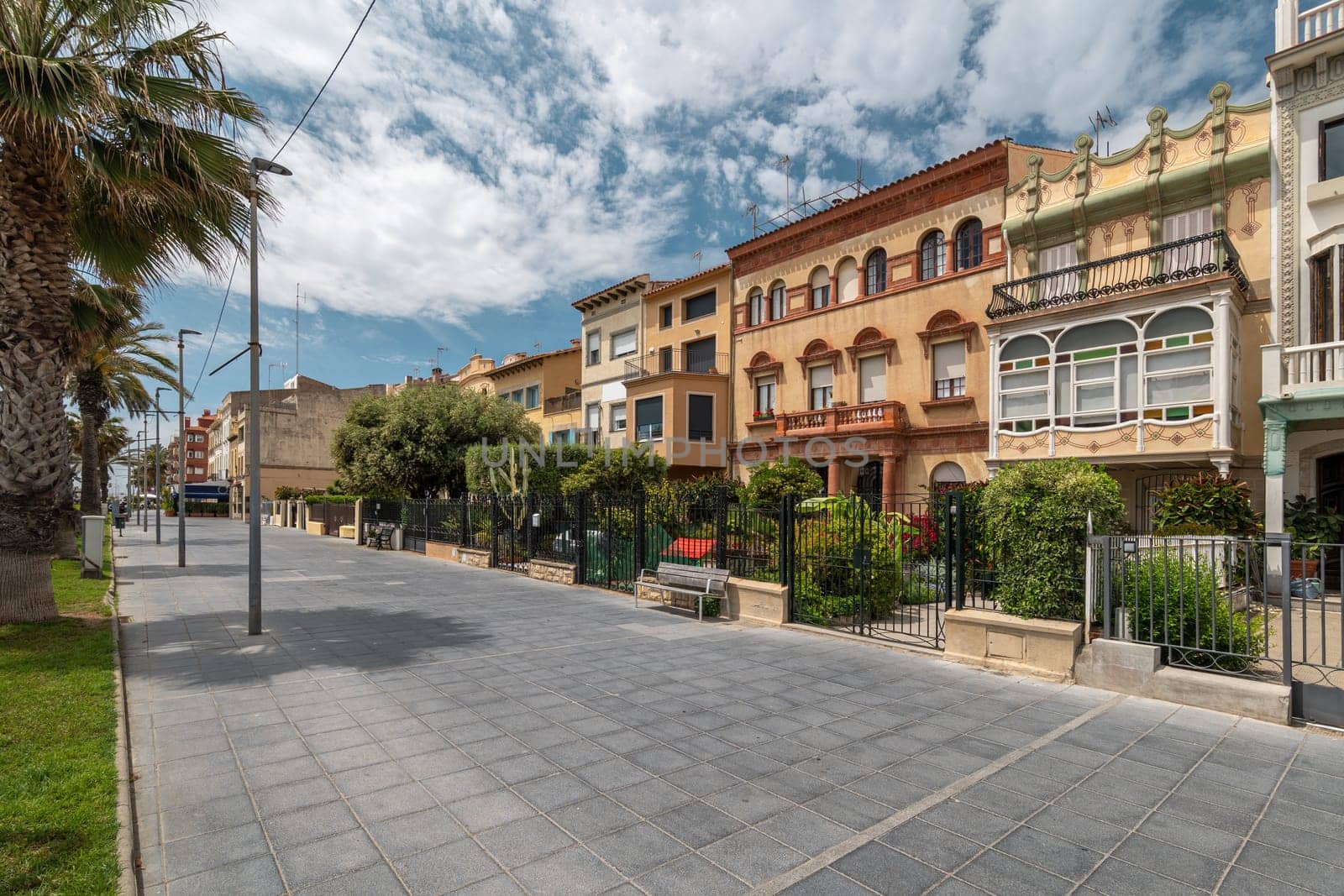 Ancient architectural style of buildings in Vilassar de Mar city. Vintage residential houses for rent at popular Catalonian resort. Spain beauty