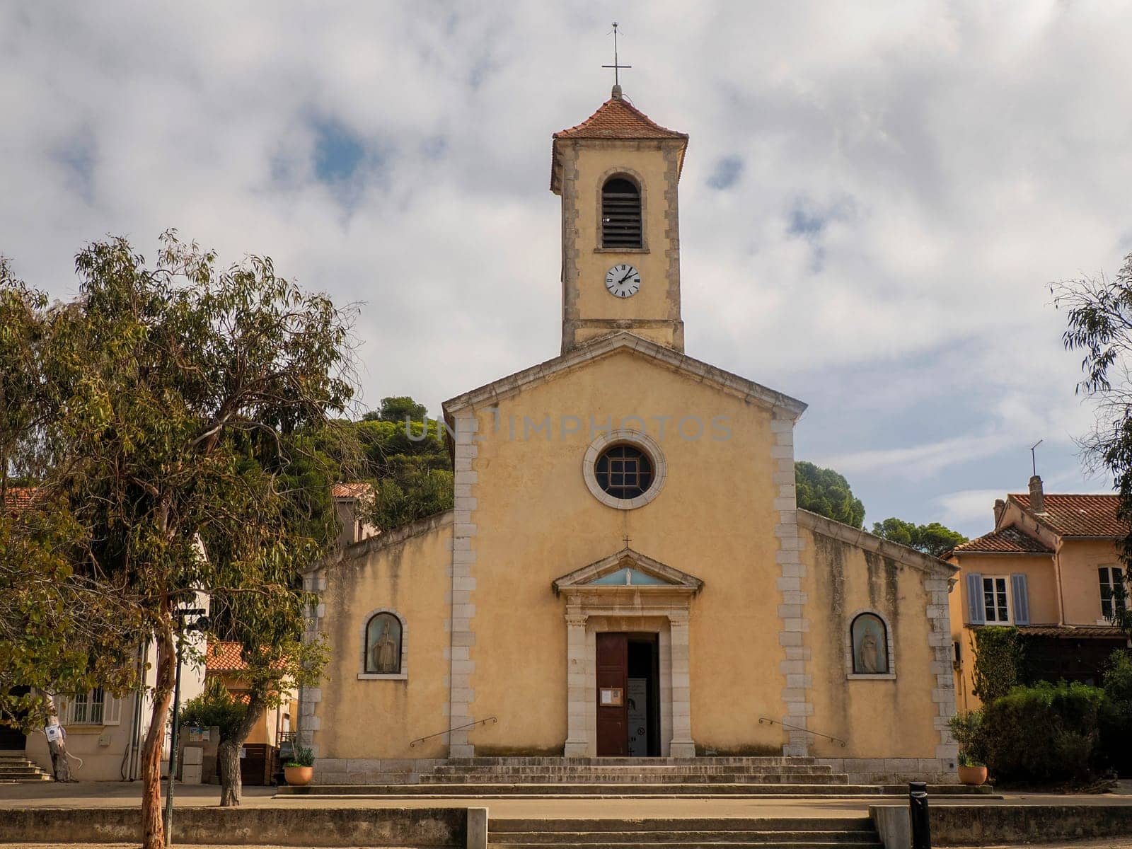old church in main place of village of porquerolles island france, panorama landscape