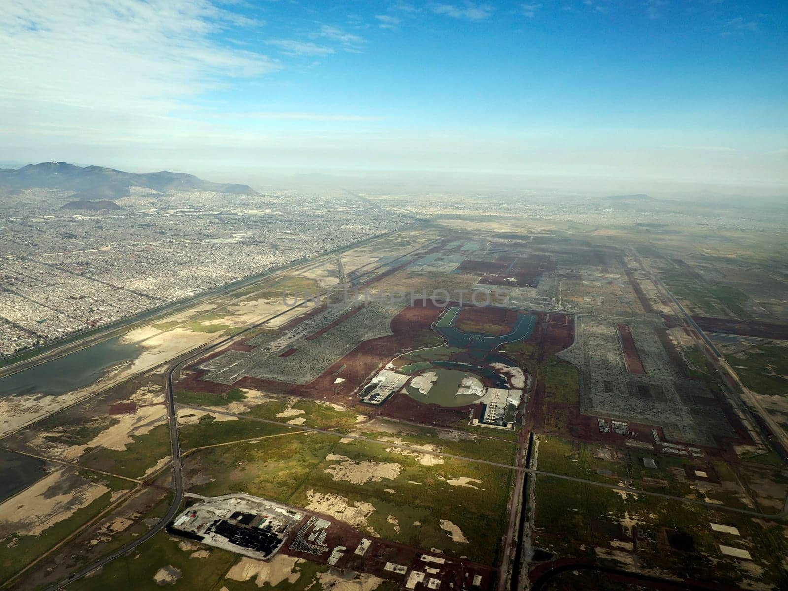 Texcoco lake ecological park mexico city aerial view landscape from airplane by AndreaIzzotti