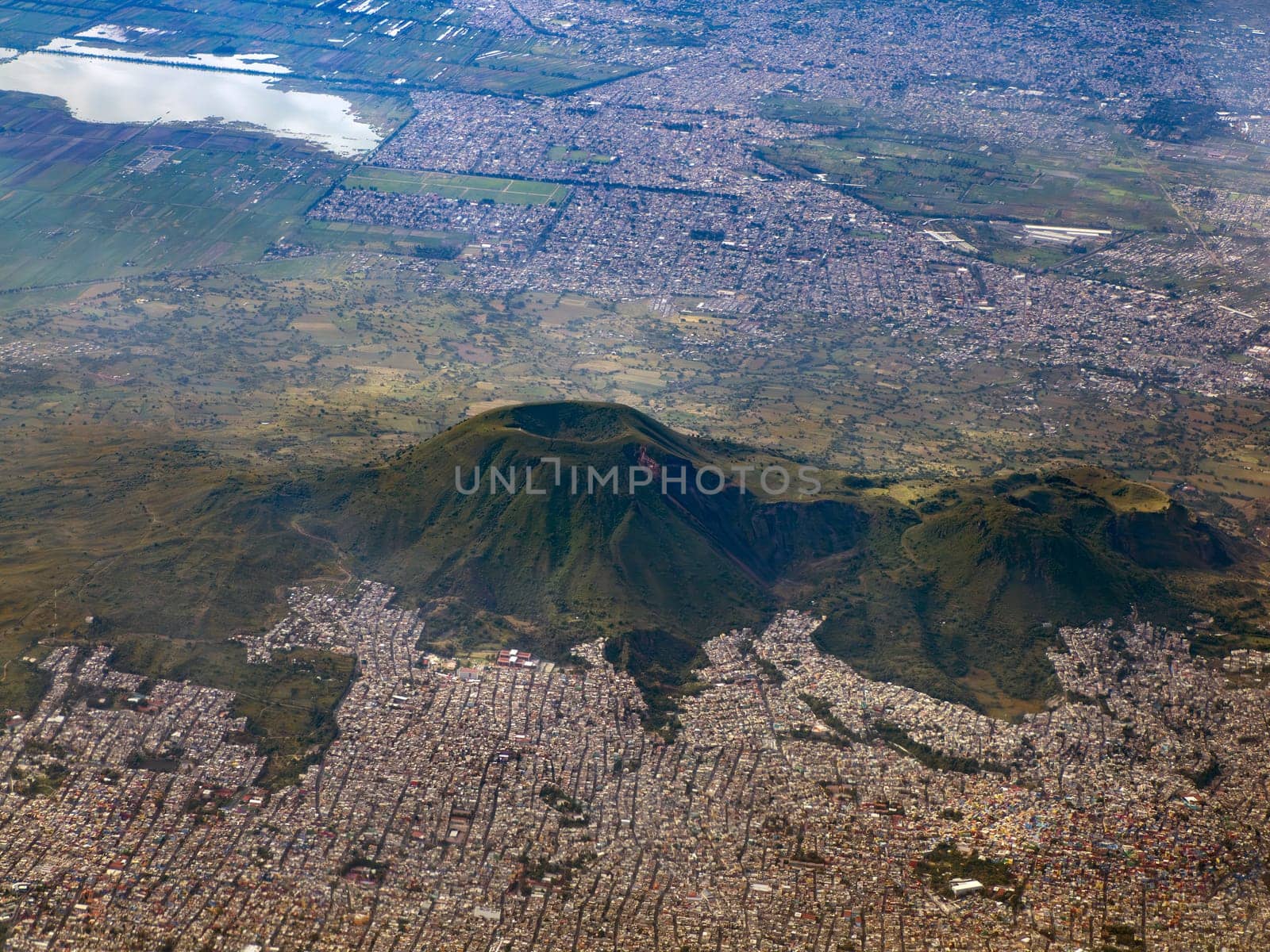 Tetlalmanche volcano in Mexico city aerial view The panorama from airplane. is one of the most famous in the City. It’s the tallest in the Sierra de Santa Catarina called also Guadalupe Volcano.