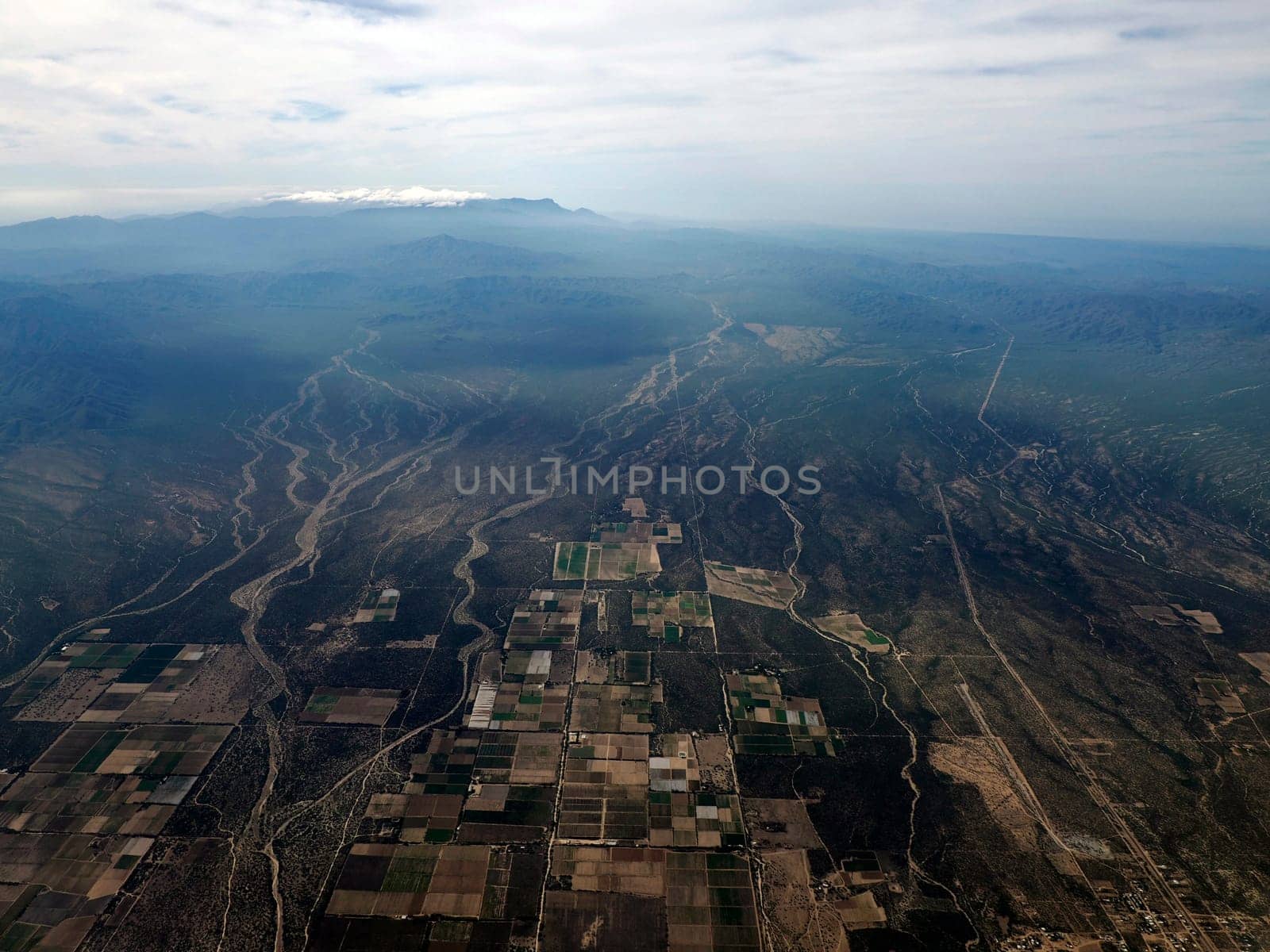 Aerial view of farmed field near la paz airport before landing in Baja California Sur, Mexico by AndreaIzzotti