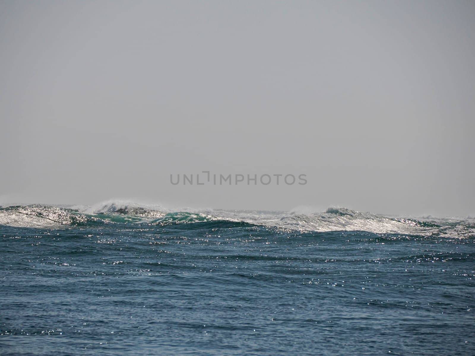 Pacific ocean waves entering Magdalena bay near Isla Santa Margarita baja california sur from boat by AndreaIzzotti