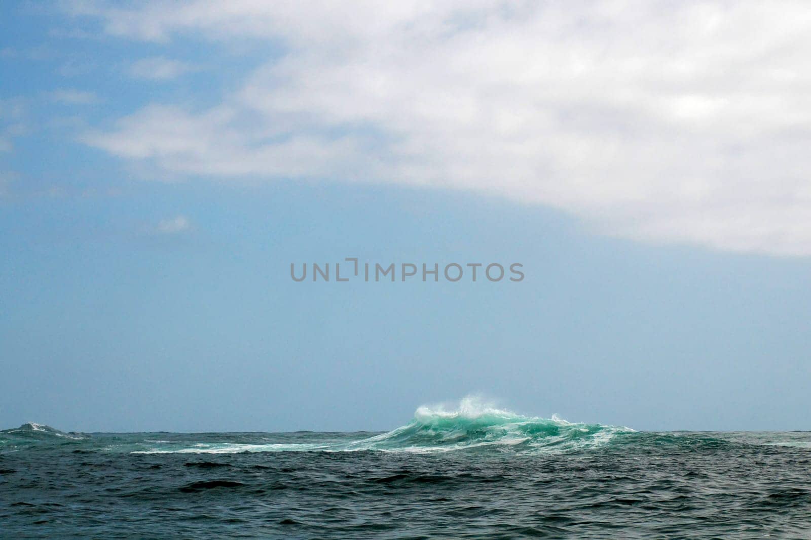 Big Pacific ocean waves entering Magdalena bay near Isla Santa Margarita baja california sur from boat