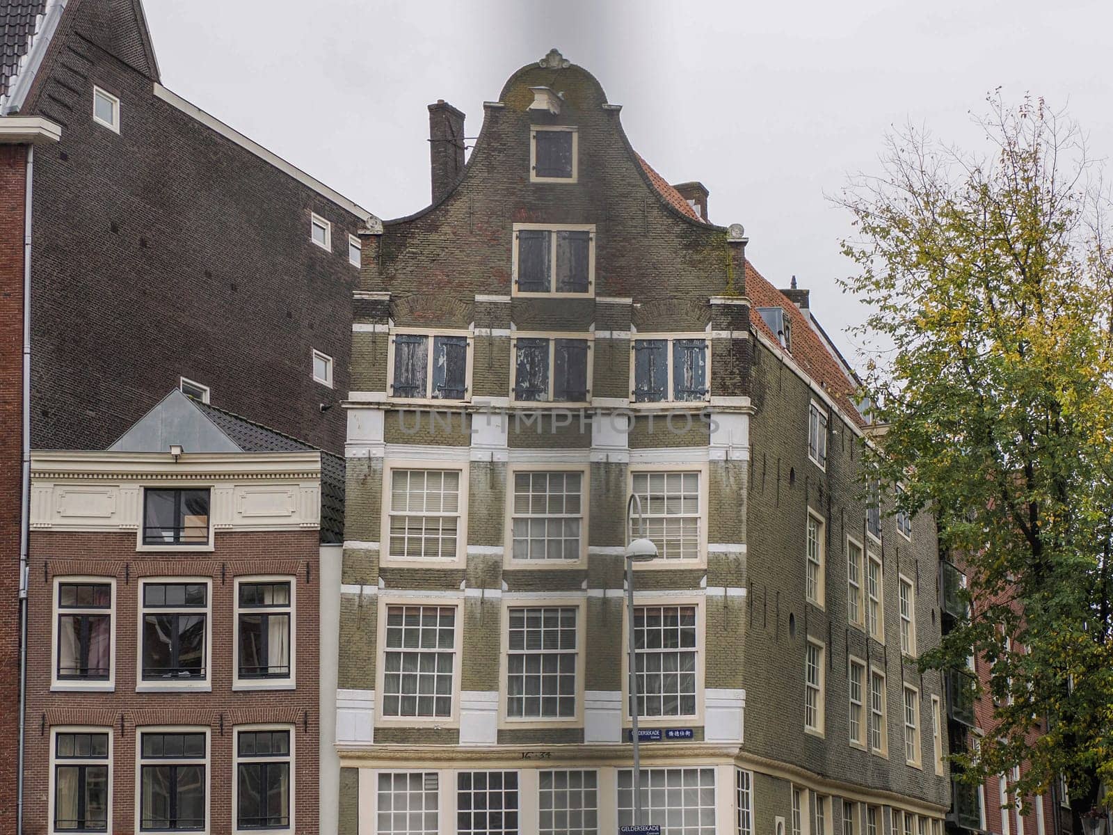 amsterdam ancient buildings over canals, netherlands