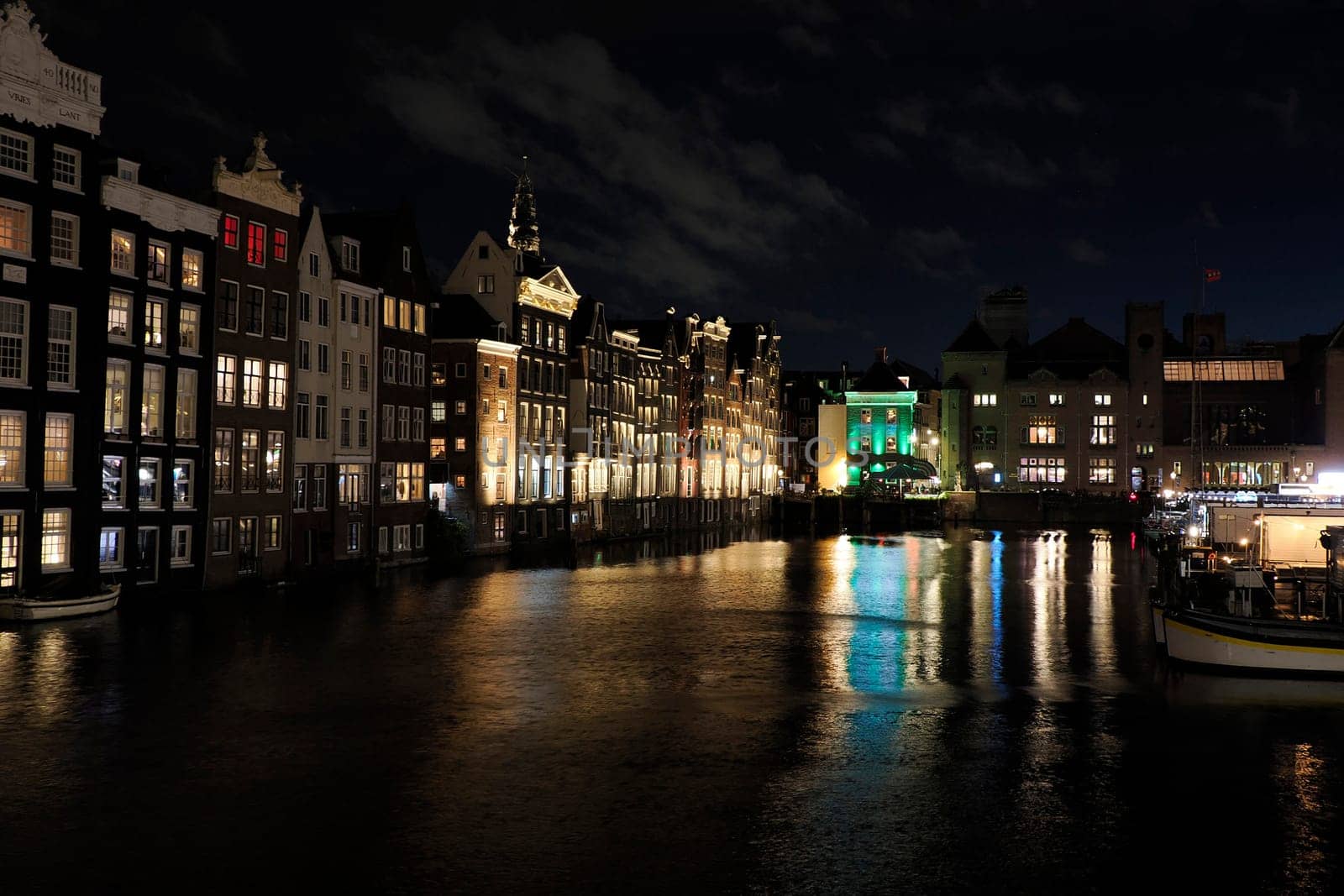 amsterdam ancient buildings over canals, netherlands night view