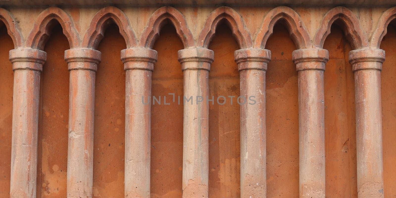 Classical pillars detail on the facade of a building concept photo. Classical pillars in a row. Urban architectural photography. by _Nataly_Nati_