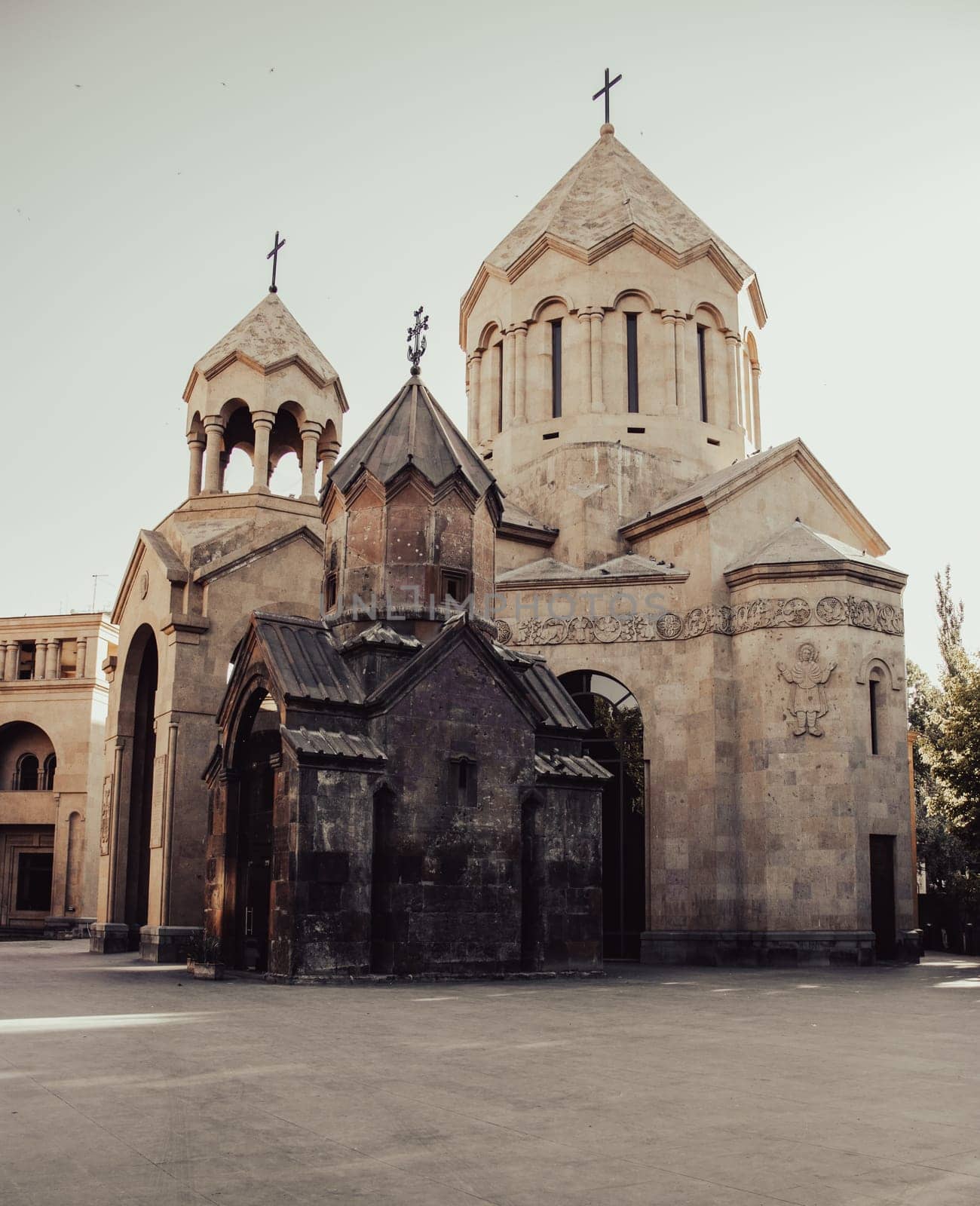 Ancient church with spires cityscape concept photo. Urban scenery photography with clear sky on background. Street scene. High quality picture for wallpaper