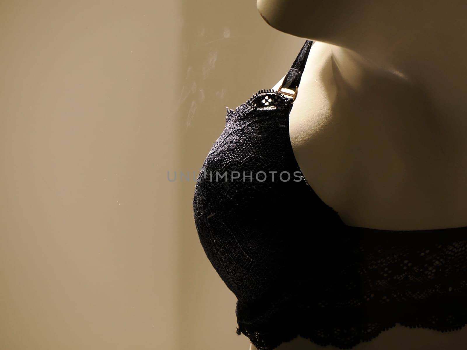 bra mannequin in shop window by AndreaIzzotti