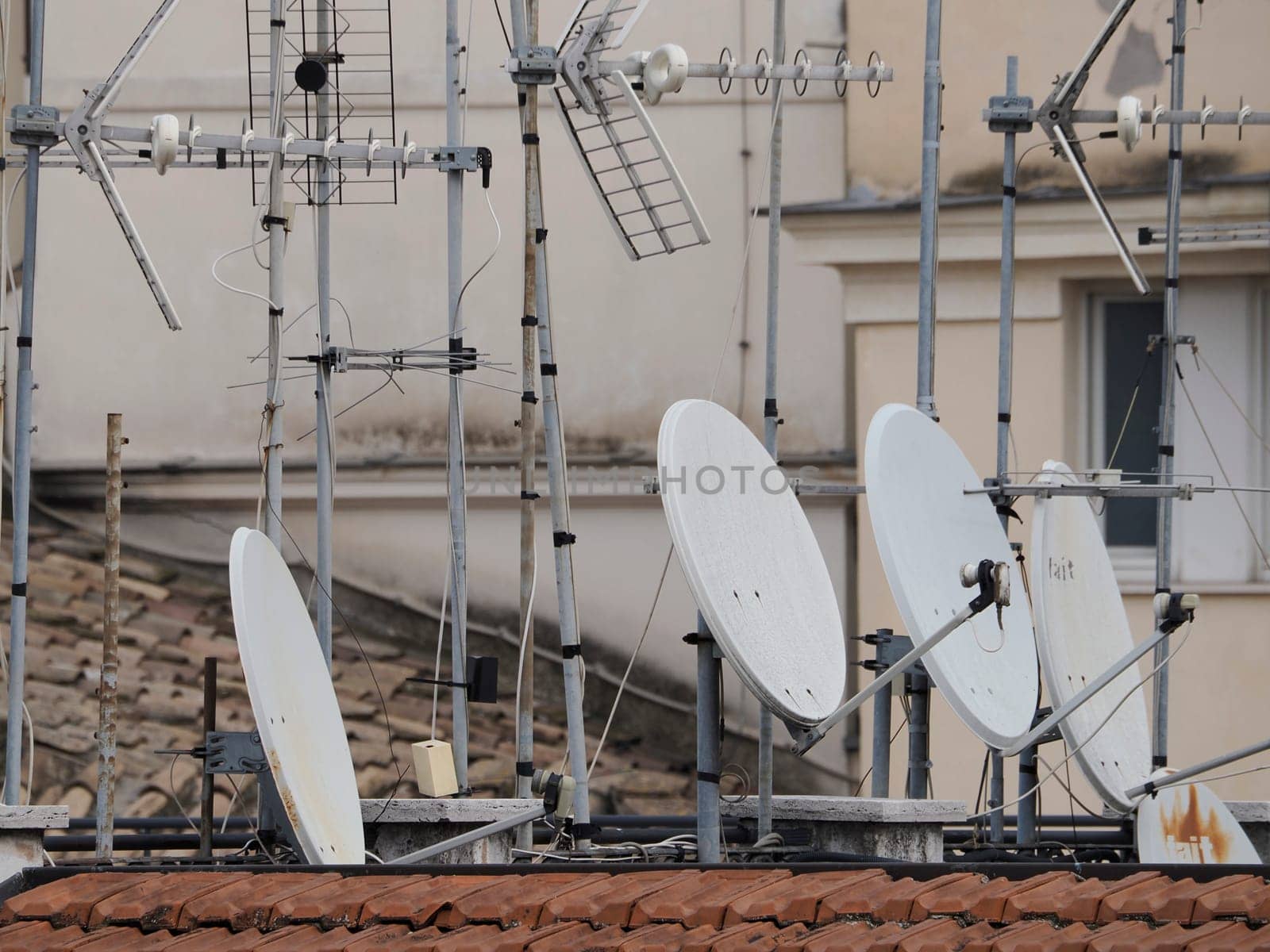 rome house roof and church dome cityscape roofdome view panorama with satellite and television antenna by AndreaIzzotti