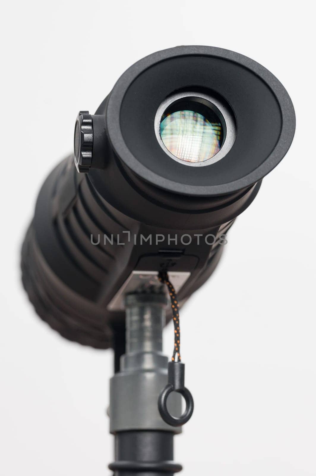 Monocular on a tripod isolated on a white field. by Niko_Cingaryuk