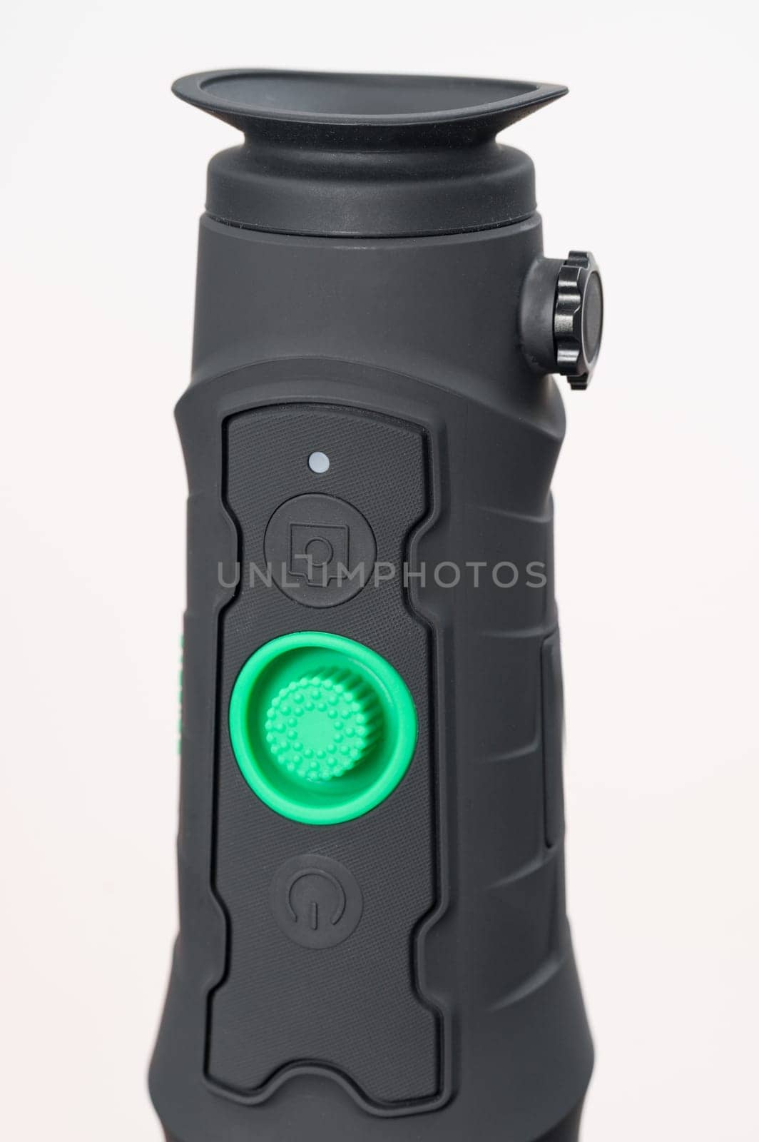 Long-range monocular isolated on white background, rubber body with large green on off button.