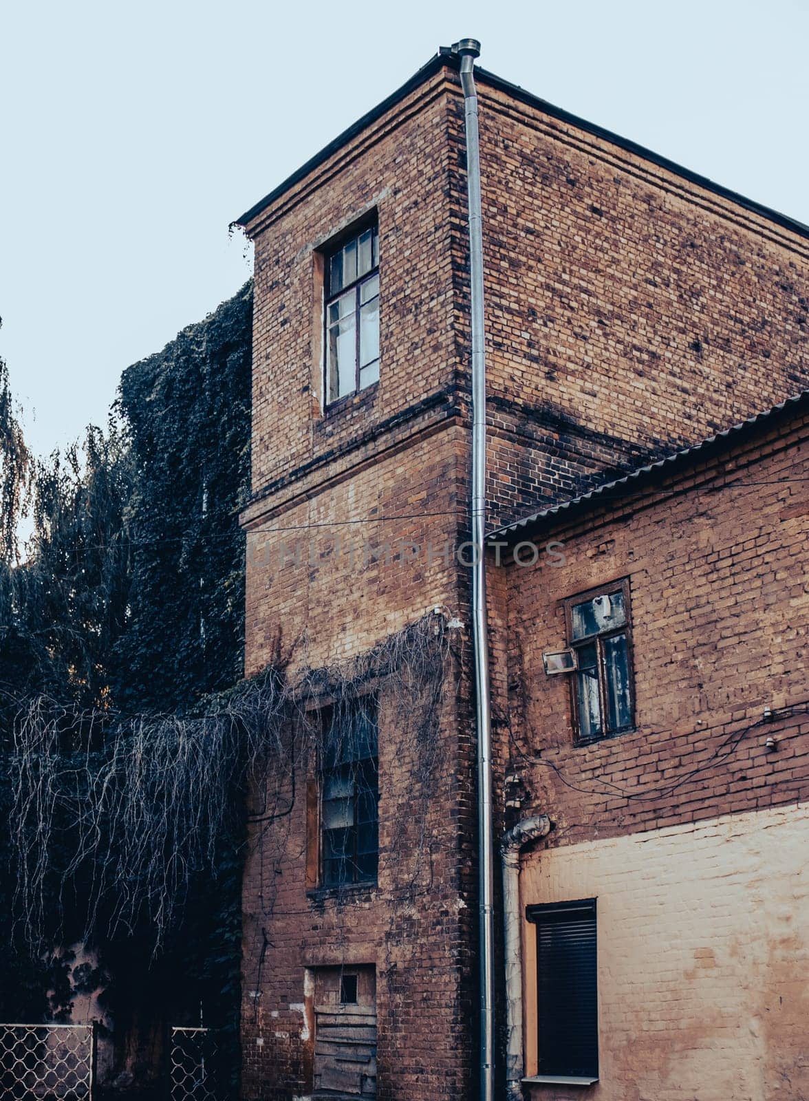 Side view of old red bricks building concept photo. Old city building photography by _Nataly_Nati_