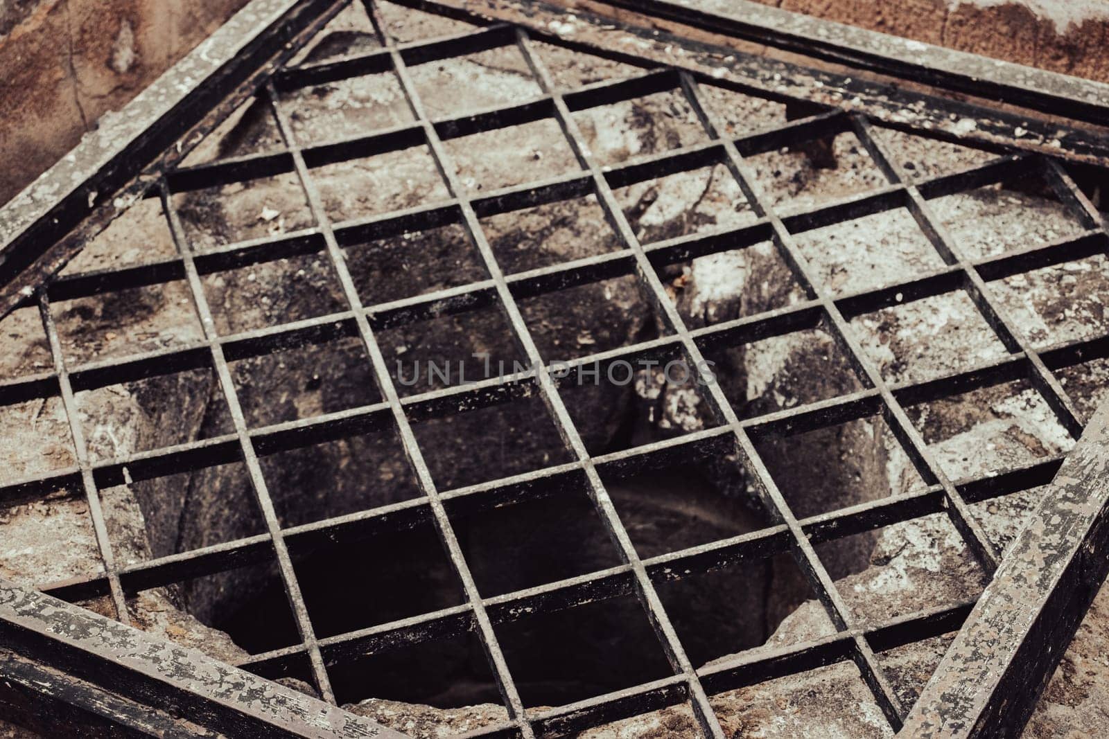 Close up old water well with iron grille close up photo. Street scene. High quality picture for wallpaper, travel blog, magazine, article by _Nataly_Nati_
