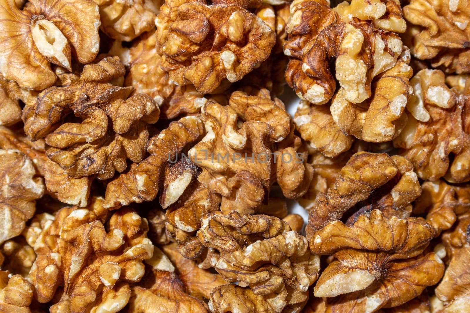 Scattered Shelled Walnuts. Background from Walnut. Natural High-Calorie Snacks