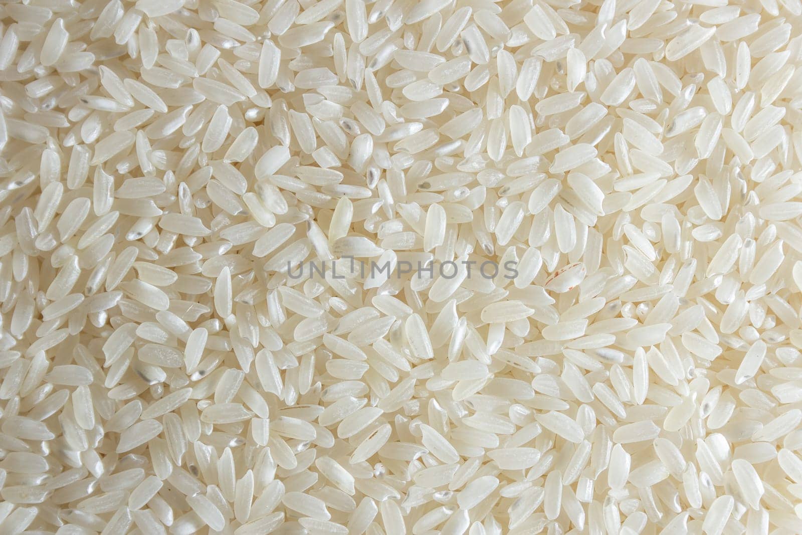 Dry Uncooked White Rice Background by InfinitumProdux