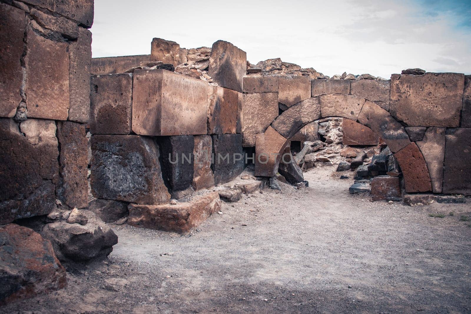 Ruins of an ancient Christian temple close up wall photo. Collapsed church. Zvartnos temple in Armenia. High quality picture for magazine, article