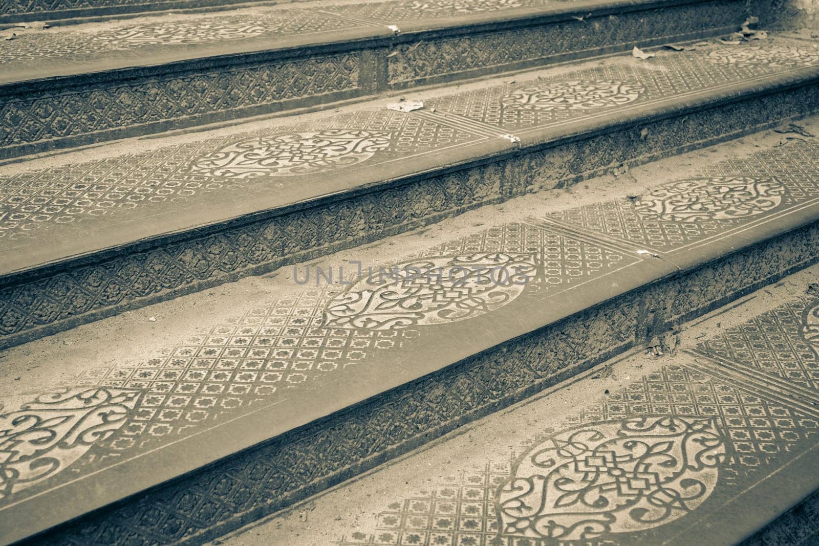 Ornate steel plate industrial staircase concept photo. Metal floor plate, steel staircase. District of European town. High quality picture for wallpaper. Suitable for background images and abstract illustrations.