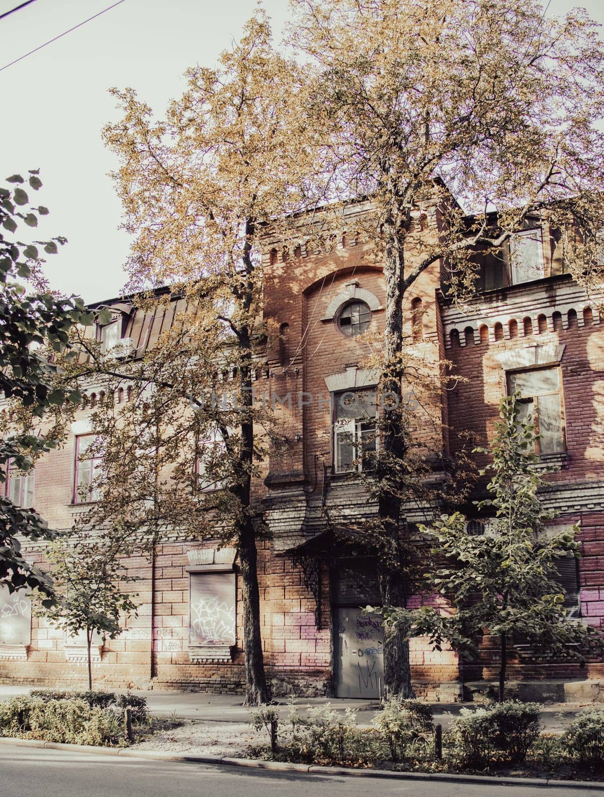 Old vintage building in autumn cityscape concept photo. Urban city life. District of European town. High quality picture for wallpaper