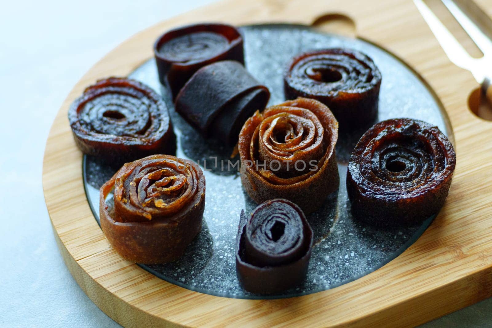 Homemade fruit leather close up. Healthy pastille. Natural vegan snack.