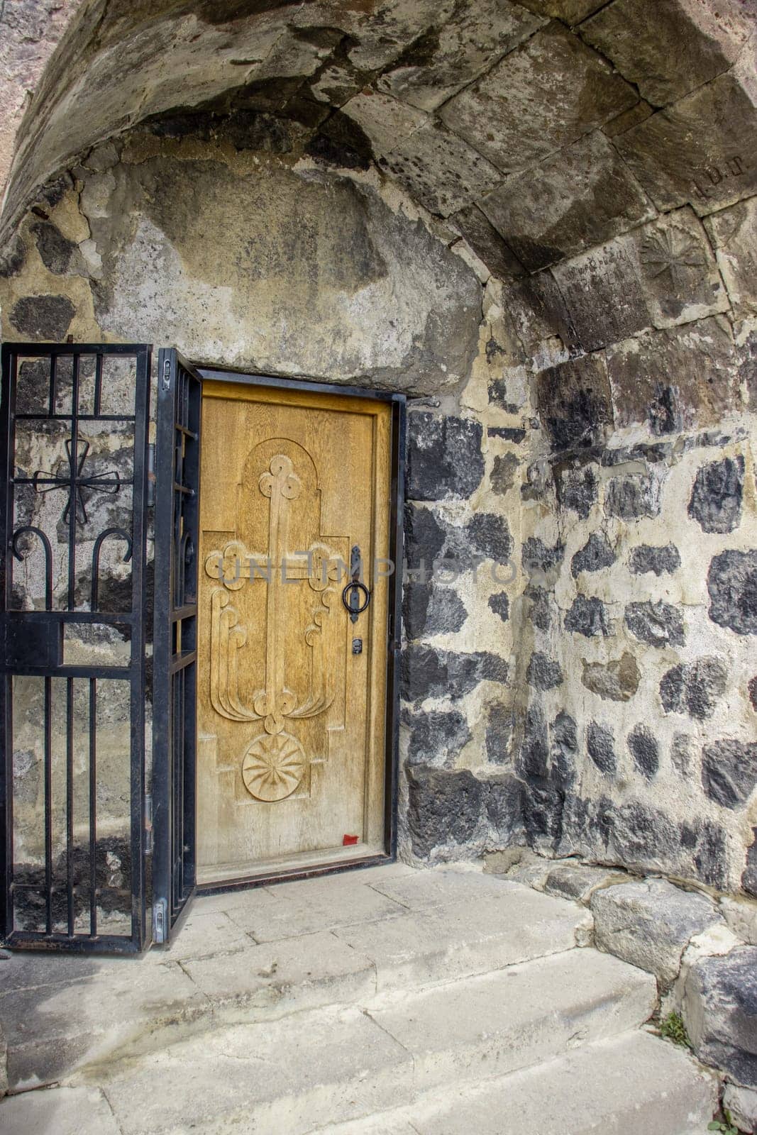 Gothic arched doorway concept photo. Monastery entrance, ancient stone architecture. High quality picture for wallpaper