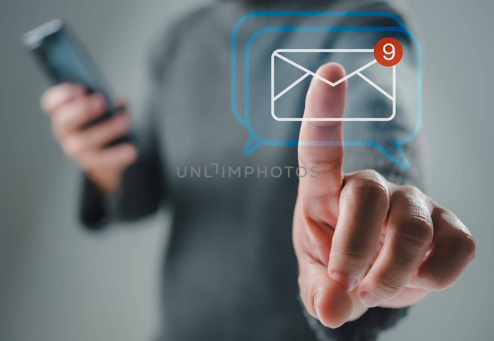 Human hand touching email on virtual screen. New email notification concept for business email communication and digital marketing. The inbox receives electronic message notifications. internet technology by Unimages2527