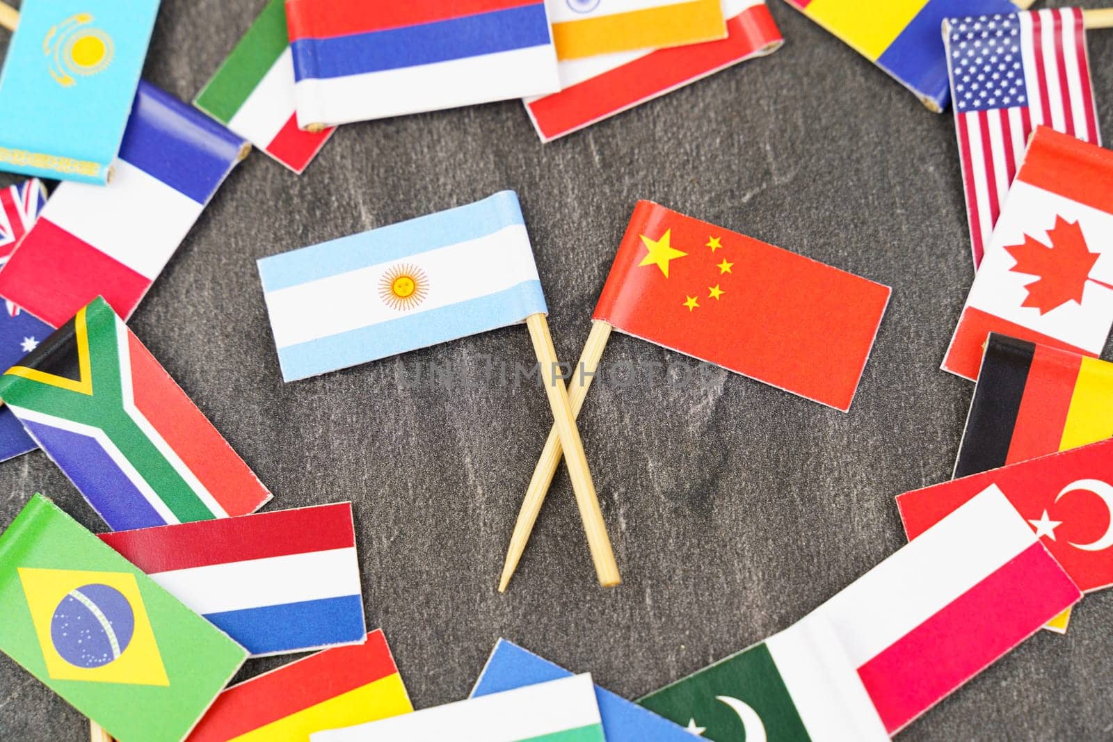 Policy. National flags of different countries. The concept is diplomacy. In the middle among the various flags are two flags - China, Argentina