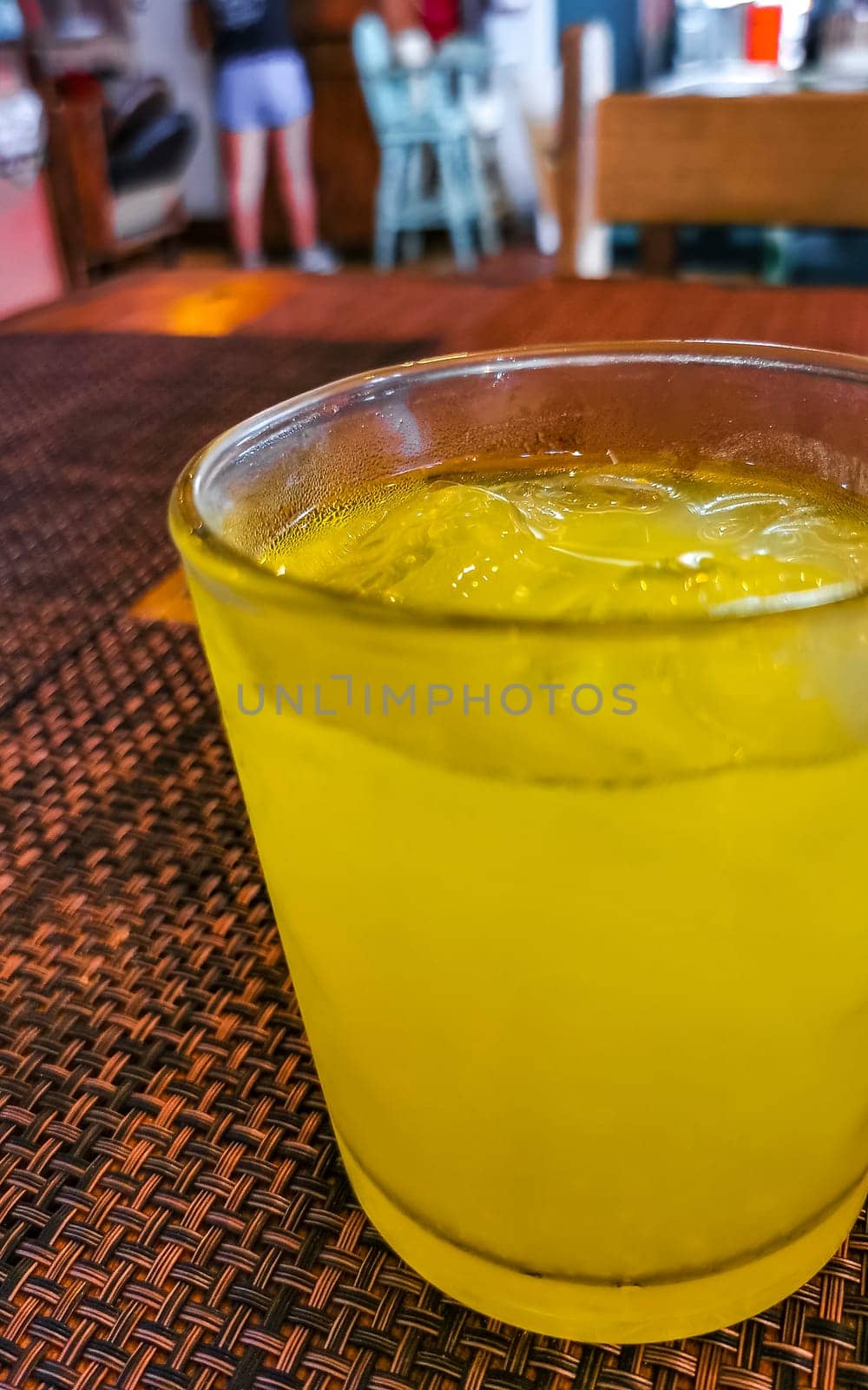 Glass of orange fruit juice food and drink in the restaurant PapaCharly Papa Charly in Playa del Carmen Quintana Roo Mexico.