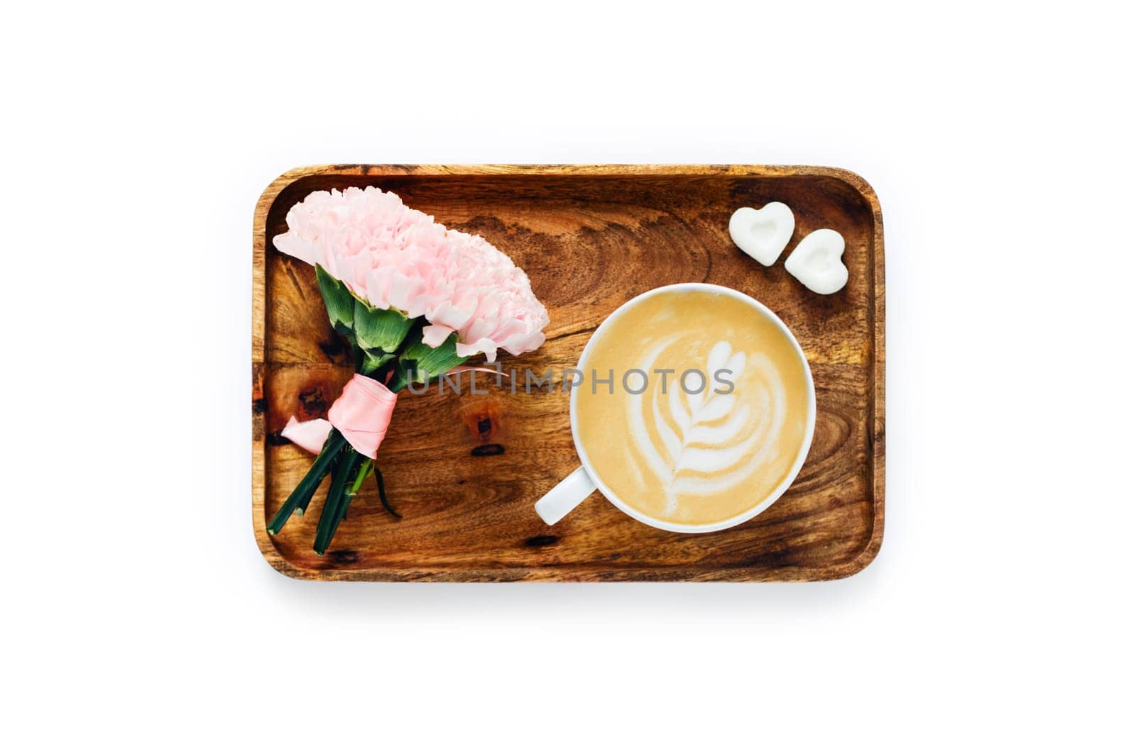 Cup of coffee with bouquet of roses and a pieces of sugar on wooden tray. Morning coffee composition.