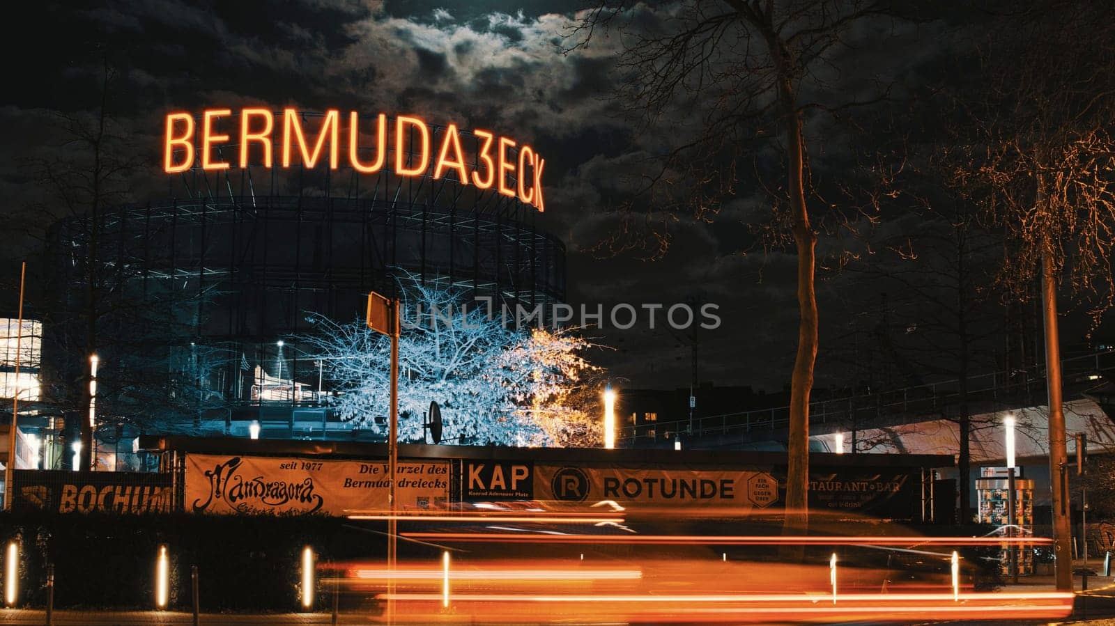 Low angle shot of an illuminated sign of the Bermuda3eck, Bermuda Triangle, in Bochum, Germany