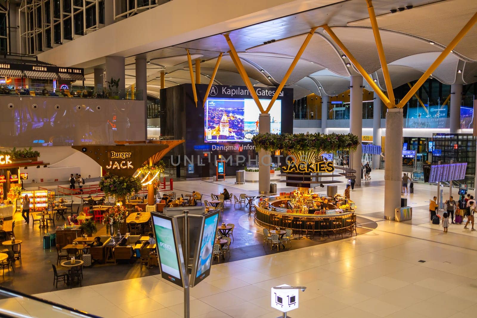 ISTANBUL, TURKEY - August 09, 2022: Modern interior of cafe and bar with snacks and drinks in Istanbul International Airport. Turkey