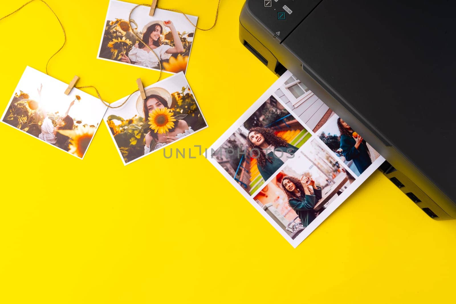 Printer printing colorful photos of people close up, yellow background by Fabrikasimf