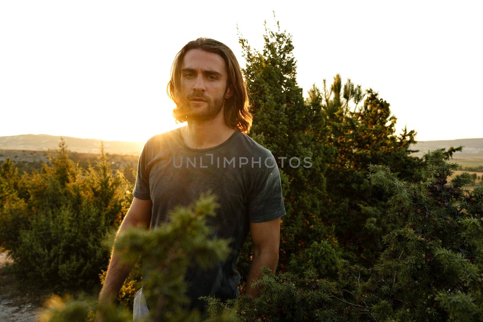 Casual man hiker outdoors in gray T-shirt outdoors portrait by Fabrikasimf