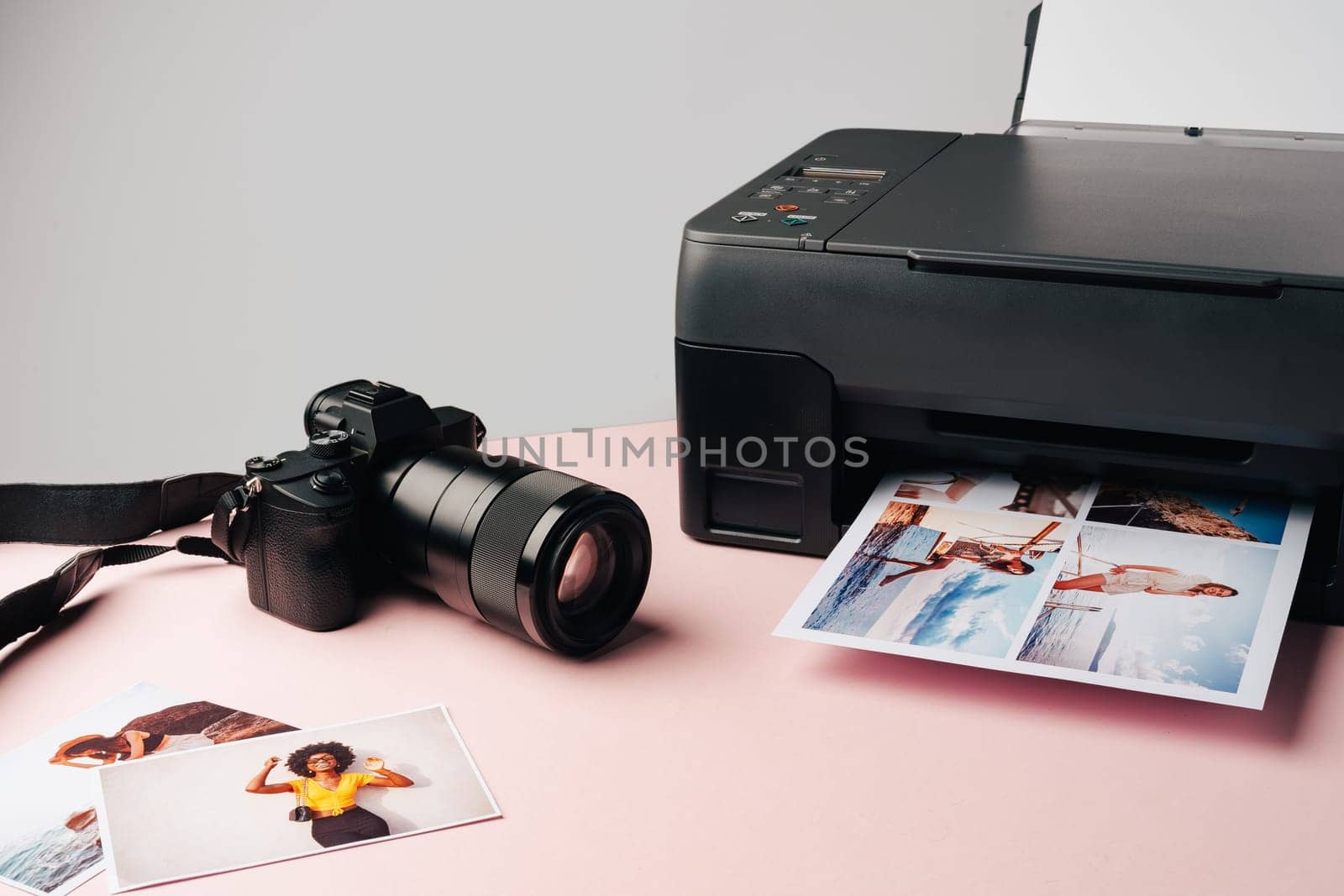 Printer and photo camera on the table. Printing photos concept