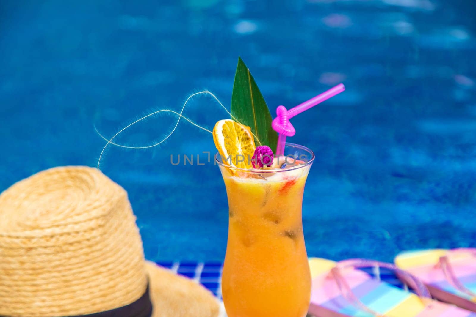 Beautiful cocktail by the pool. Selective focus. by yanadjana