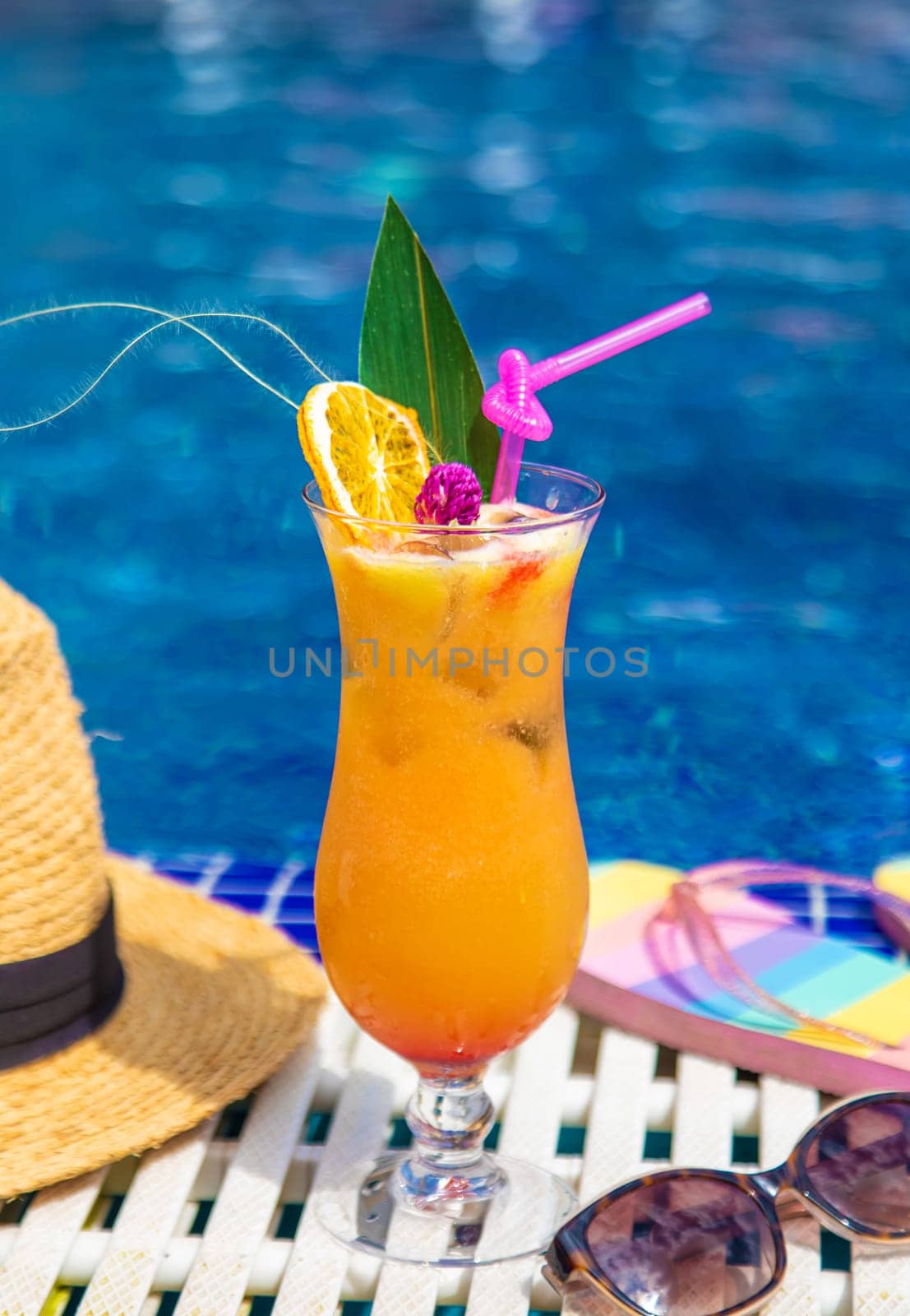 Beautiful cocktail by the pool. Selective focus. by yanadjana