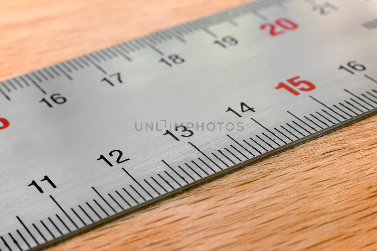 A fragment of metal measuring ruler with centimeter and millimeter divisions.